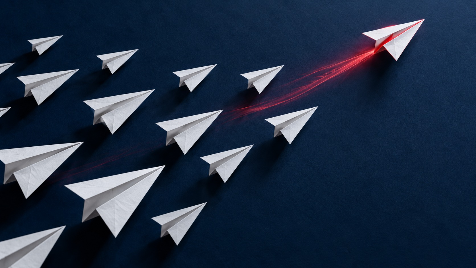 A red-trail paper airplane leading a group against a navy background.