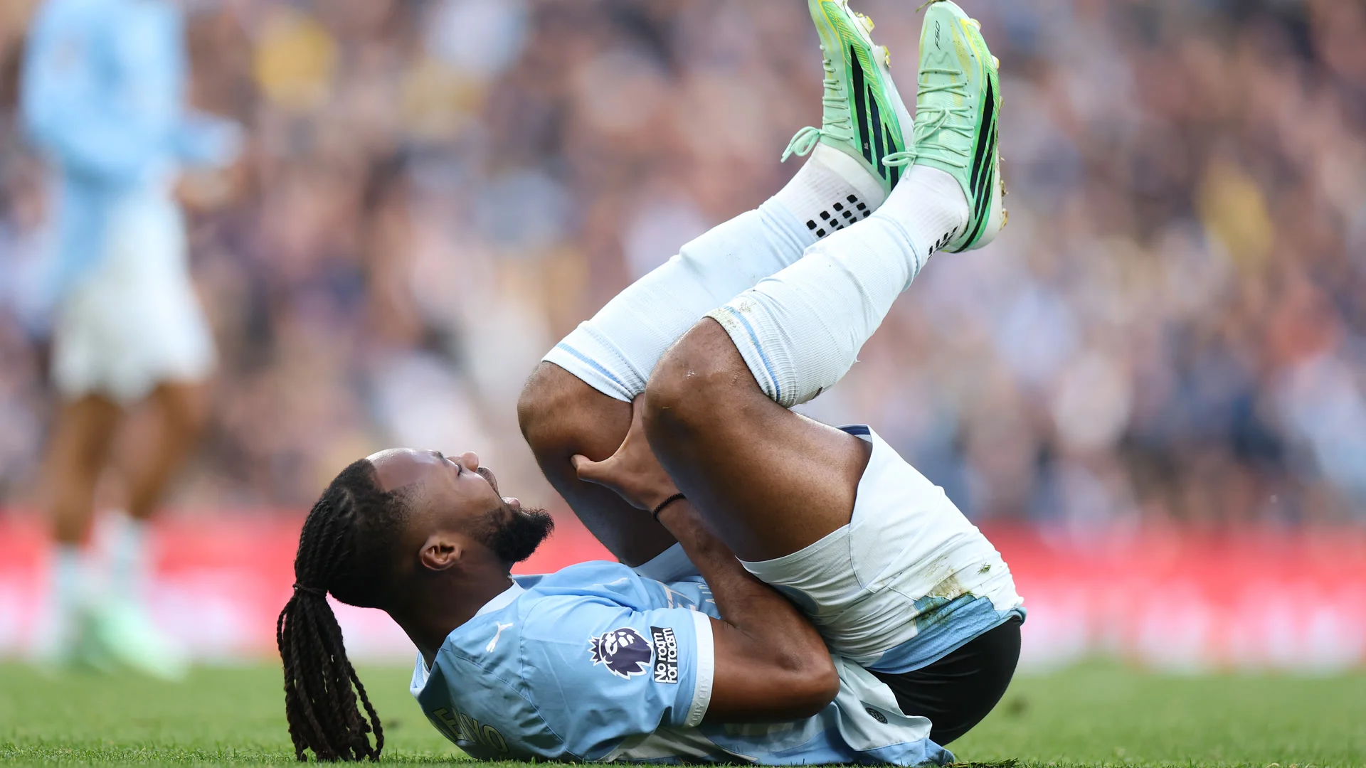 Antoine Semenyo lies on the pitch holding his leg in Manchester City's sky-blue home kit after picking up a knee injury against Ipswich Town at the Etihad Stadium on 17 October 2026. Photo: Michael Steele/Getty Images