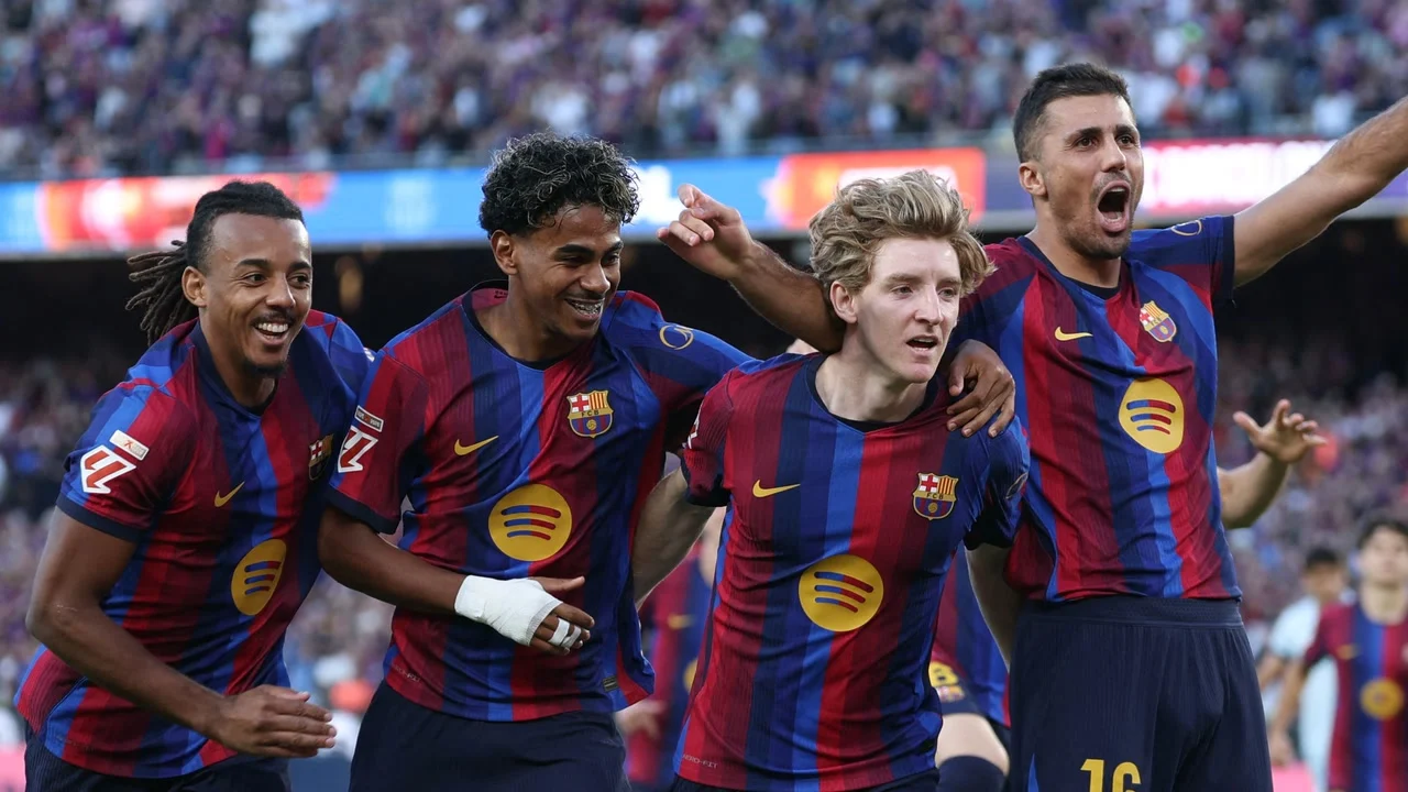 Anthony Gordon celebrates with Barcelona team-mates Jules Koundé, Lamine Yamal and Rodri in the club's blue and red home kit at the Spotify Camp Nou. Photo: AFP via Getty Images