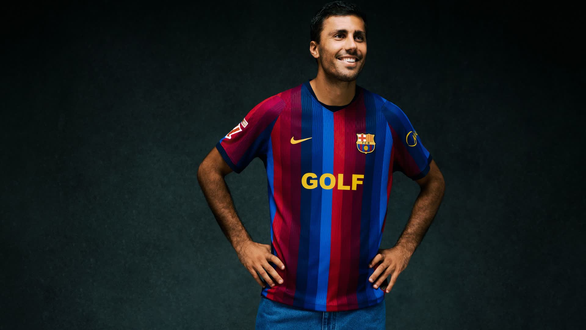 A Barcelona player wears the red-and-blue Clásico shirt with the GOLF logo of Tyler, The Creator in a club photoshoot