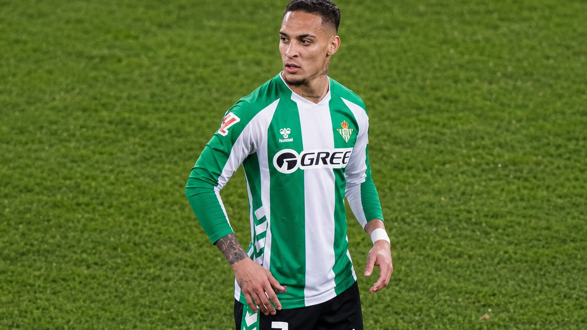 Antony in a Real Betis green and white striped kit on the pitch