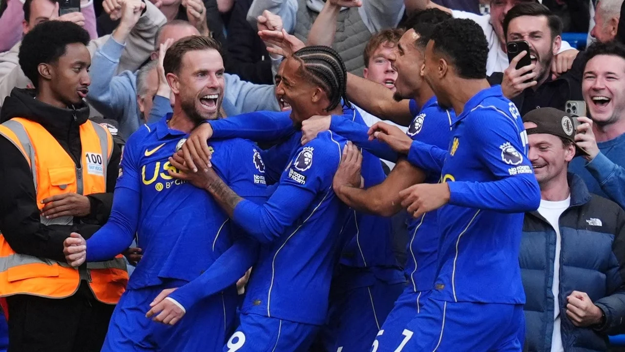 Jordan Henderson celebrates with Chelsea team-mates in the club's blue home kit at Stamford Bridge after scoring against Bournemouth. Photo: Adam Davy/PA Wire