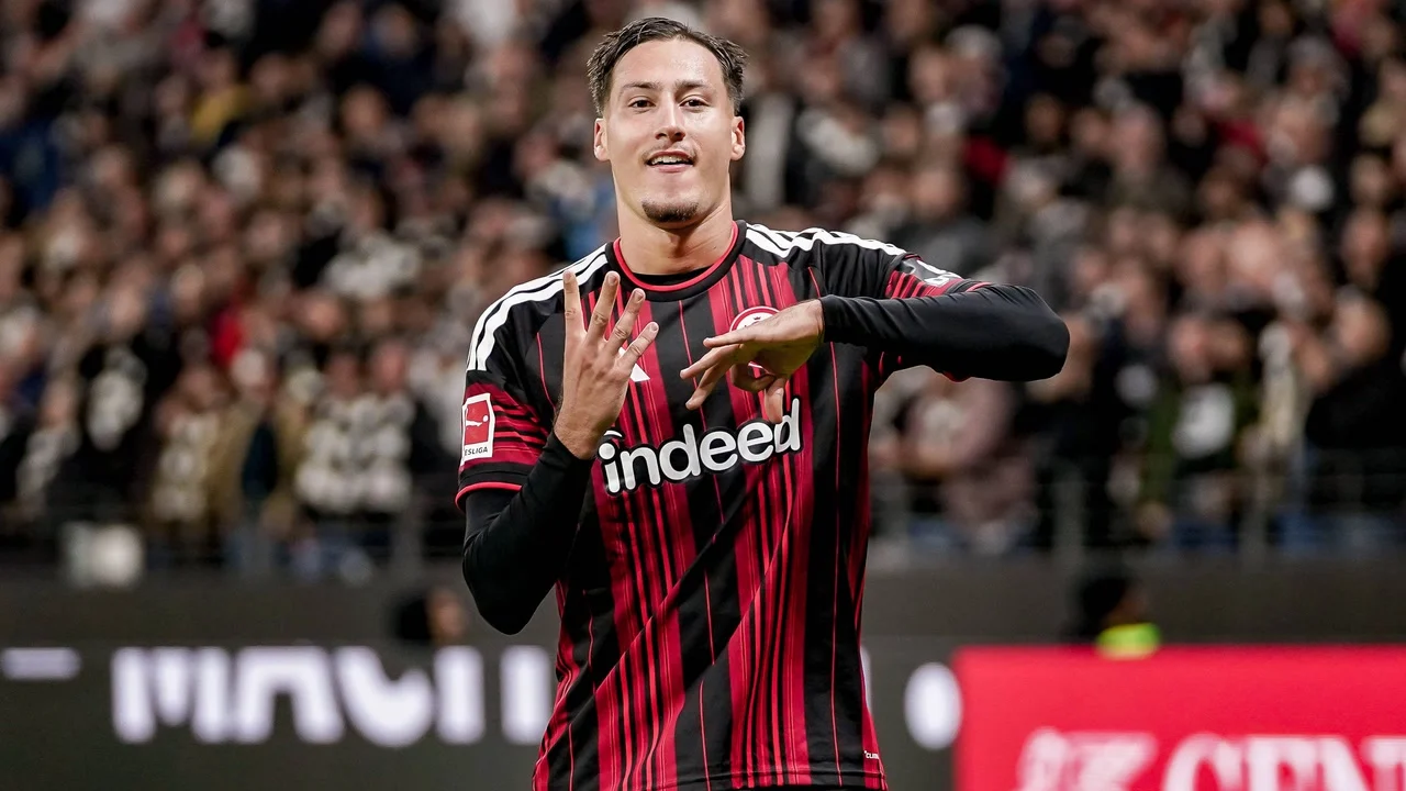 Younes Ebnoutalib celebrates in Eintracht Frankfurt's black-and-red striped home kit after scoring the winner against 1. FC Köln at Deutsche Bank Park on 16 October 2026. Photo: IMAGO via Bundesliga.com