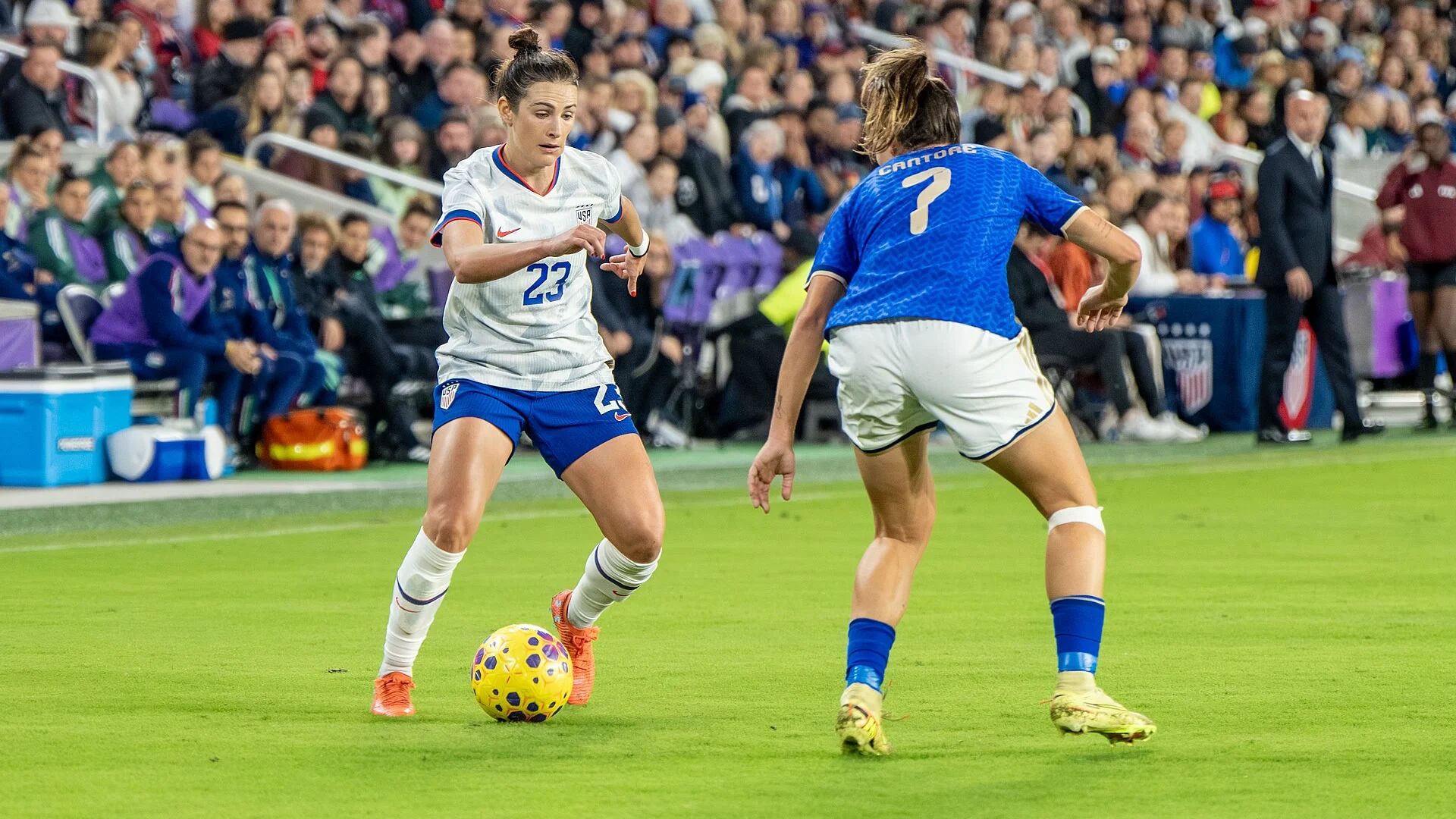 Emily Fox in a white USWNT kit (number 23) controlling the ball during the United States vs Italy match on 28 November 2025