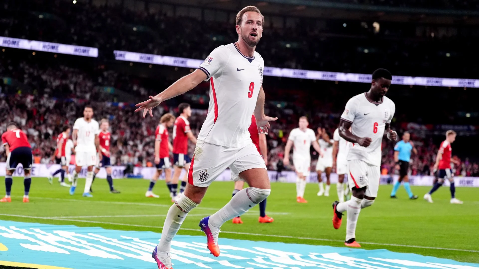 Harry Kane, in England's white number 9 shirt, celebrates with arms outstretched after scoring against Czechia at Wembley, with Marc Guéhi following behind (Photo: Sky Sports)