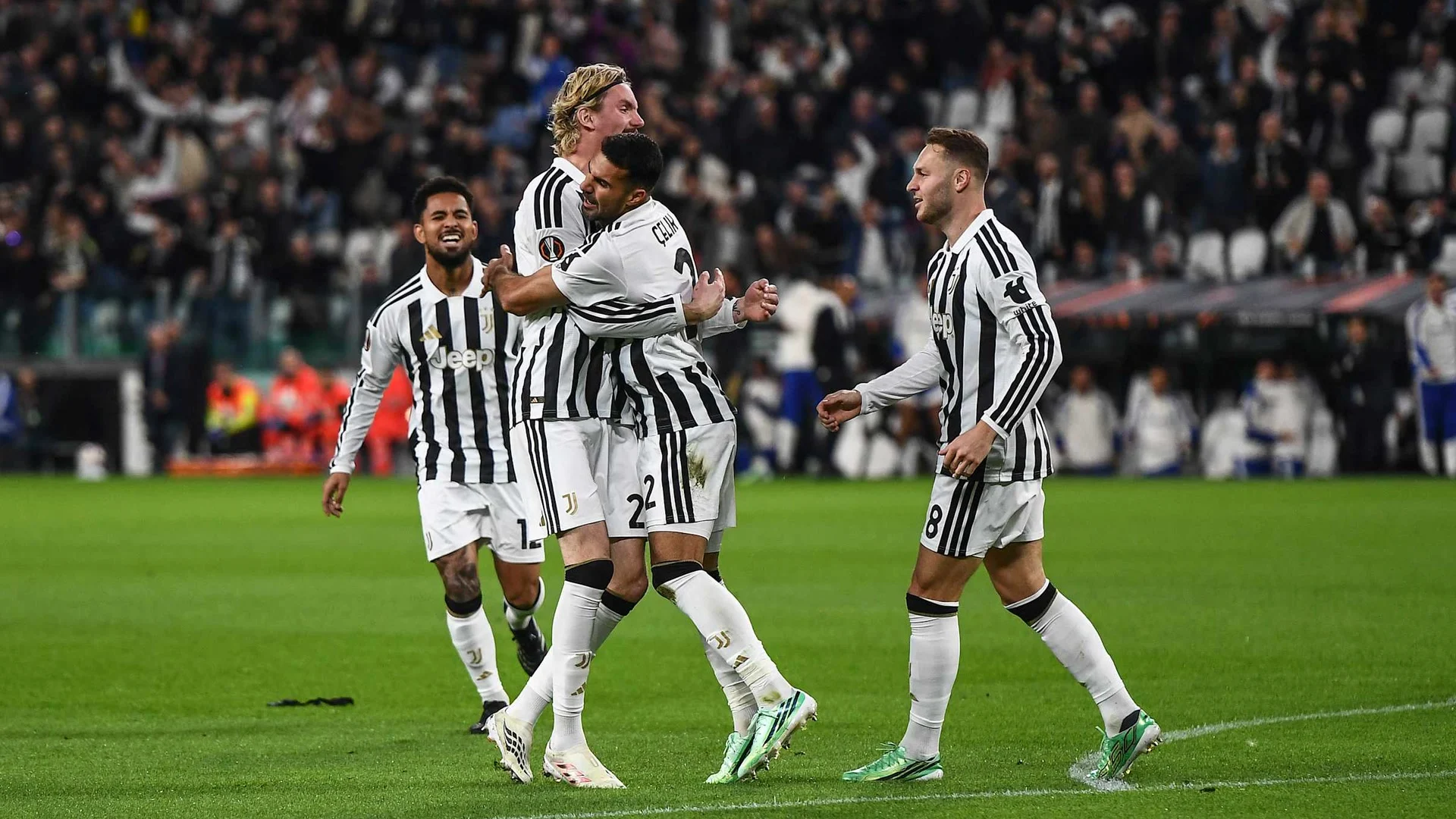Juventus defender Zeki Çelik (number 2, black-and-white striped home kit) is embraced by Nick Woltemade as Teun Koopmeiners (number 8) and another teammate join the celebration against Rennes at the Allianz Stadium. Photo: Juventus FC