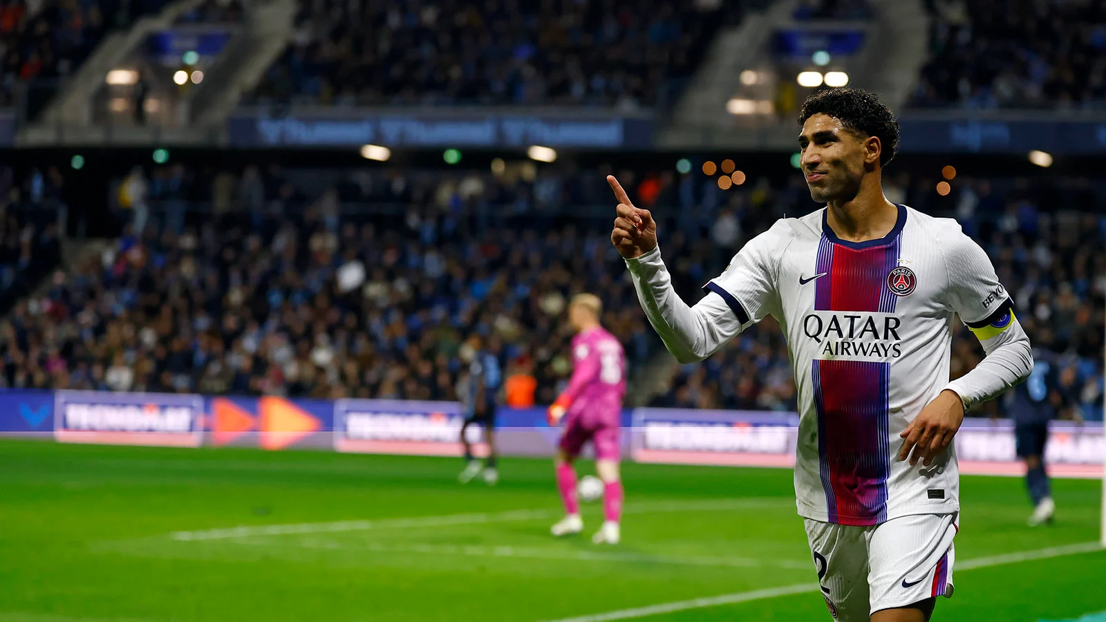 Achraf Hakimi celebrates in Paris Saint-Germain's white away kit during the Ligue 1 win at Le Havre at Stade Océane
