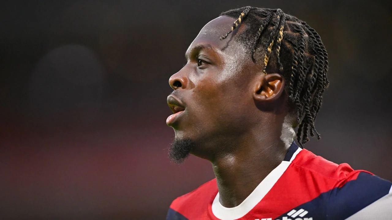 Dilane Bakwa of Lille, in the club's red and navy home kit, during a Ligue 1 match. Photo: Kevin Clement/Icon Sport