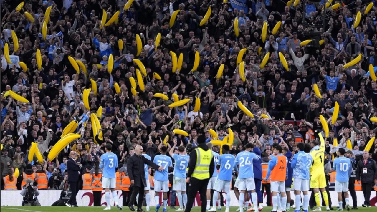 Manchester City fans wave inflatable bananas in the away end at Anfield as Enzo Maresca and his players in light-blue kits applaud them after the 3-0 win over Liverpool. Photo: PA Media