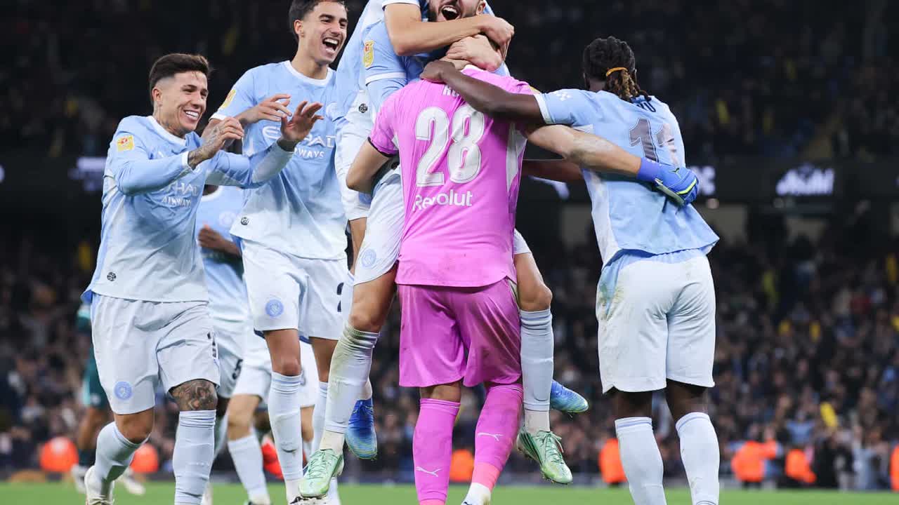 Manchester City players mob goalkeeper Gerónimo Rulli after his shootout saves against Brighton at the Etihad (Photo: James Gill/Danehouse/Getty Images via The Guardian)