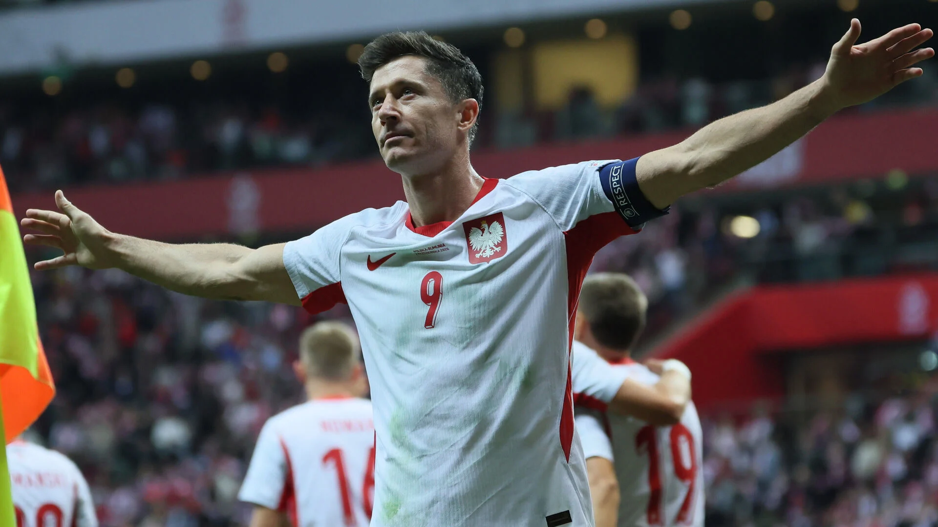 Robert Lewandowski, in Poland's white number 9 shirt and captain's armband, celebrates a goal against Romania in Warsaw (Photo: PAP/Leszek Szymański)