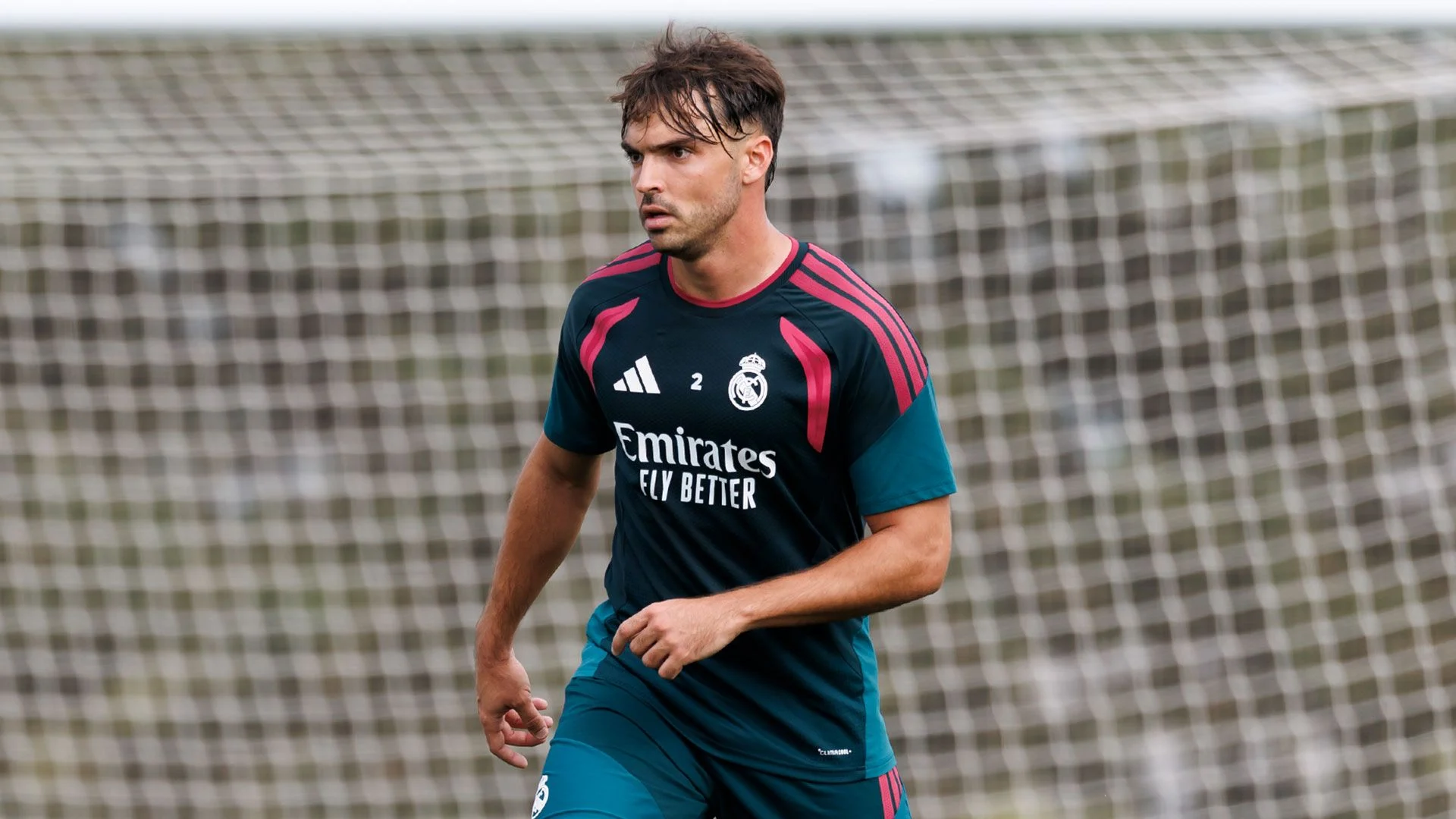 Raúl Asencio in a Real Madrid training kit during a training session