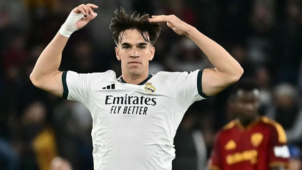 Carlos Espí in Real Madrid's white kit celebrates scoring against Roma at the Stadio Olimpico, with a Roma player in red behind him. Photo: Getty Images via BBC Sport
