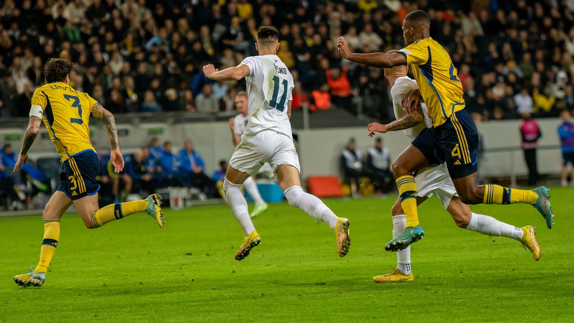 Benjamin Šeško in Slovenia's white kit, number 11, during a Nations League match against Sweden